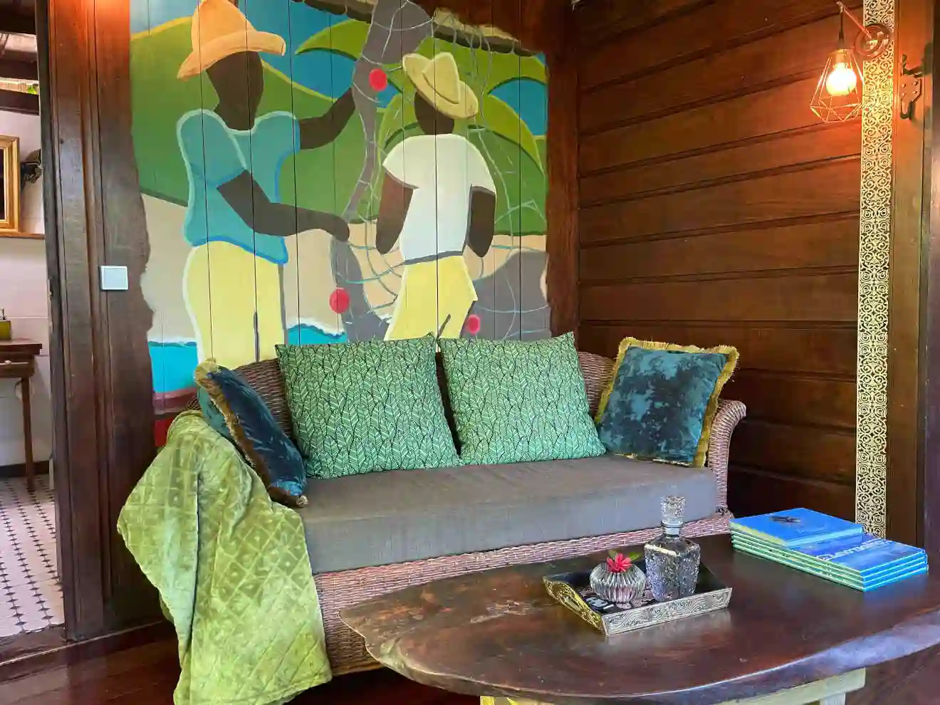 A true Creole hut, voluptuous red wood, local art.